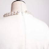 Pull avec collier de perles