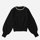 Pull avec collier de perles